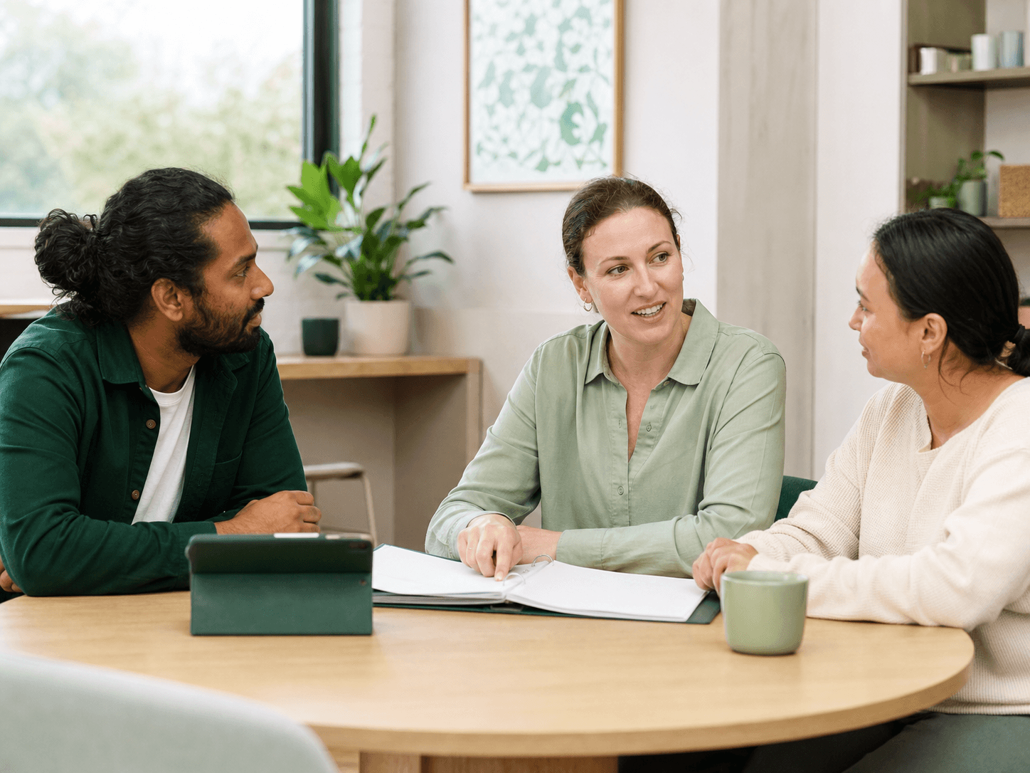 A disability-services team discussing a policy during training